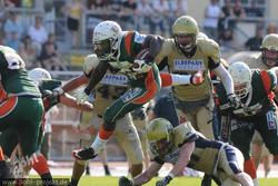two football players fighting for the ball